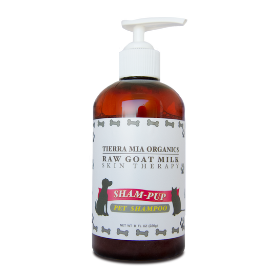 plastic amber bottle with a label that reas "Tierra Mia Organics Sham-pup Pet Shampoo